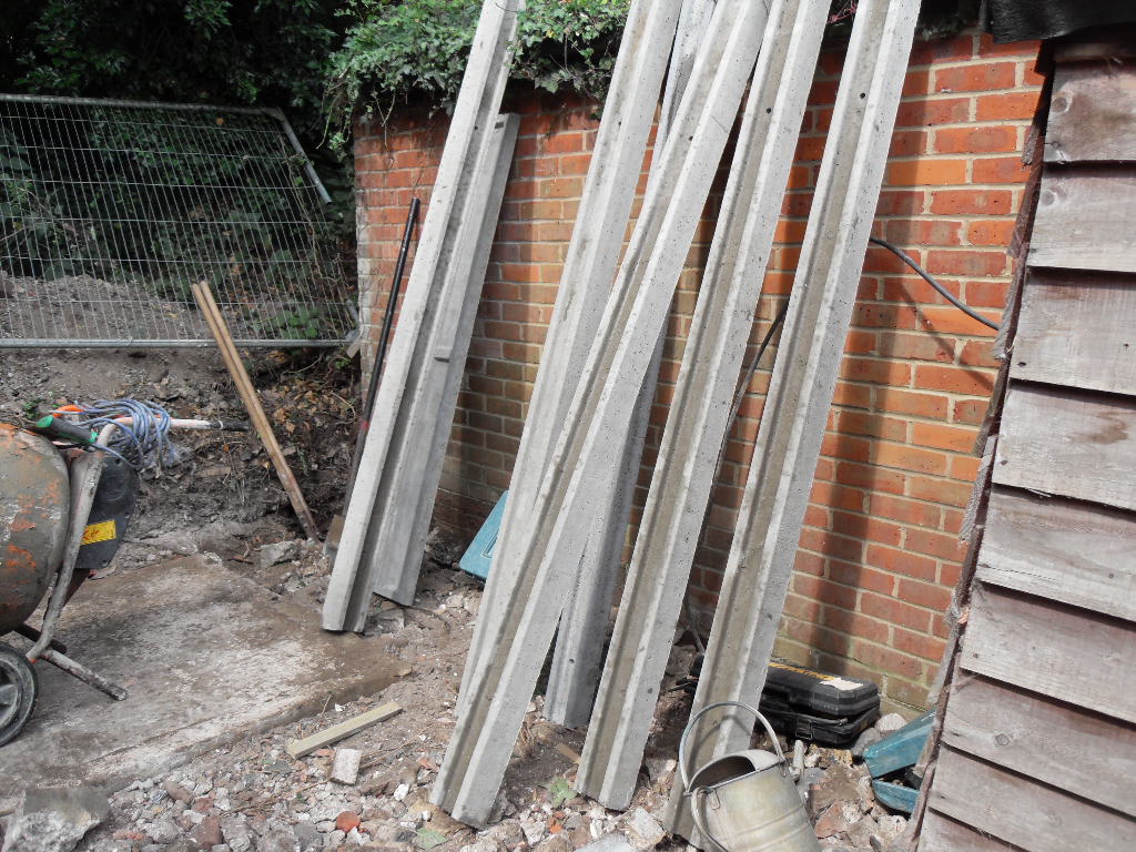 The concrete gravel boards which had to be carried up the length of our garden