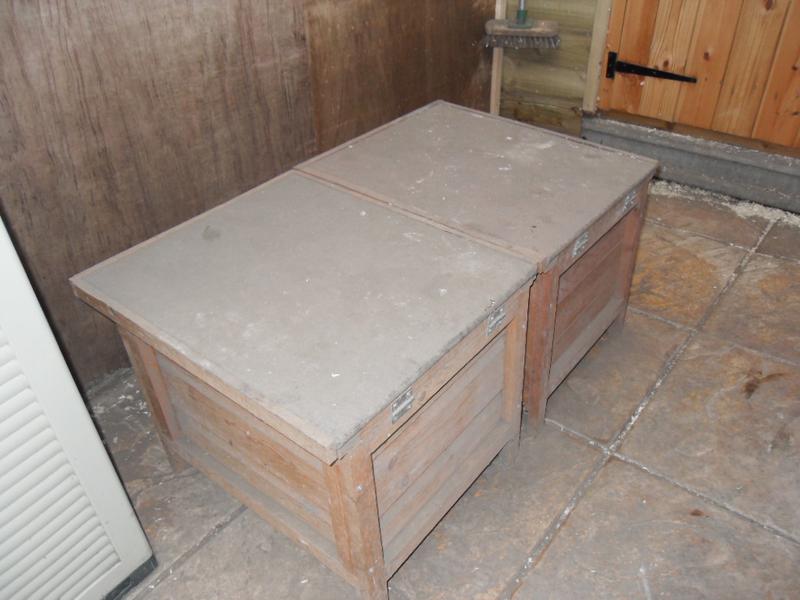The two little coop nest boxes on the chicken's patio area