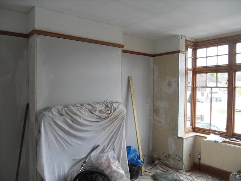 The brickwork is now under plaster board and the ceiling has had it's first coat of white paint.