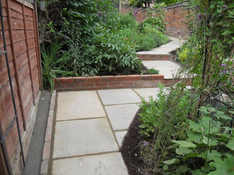 The wall and steps at the end of the veg plot
