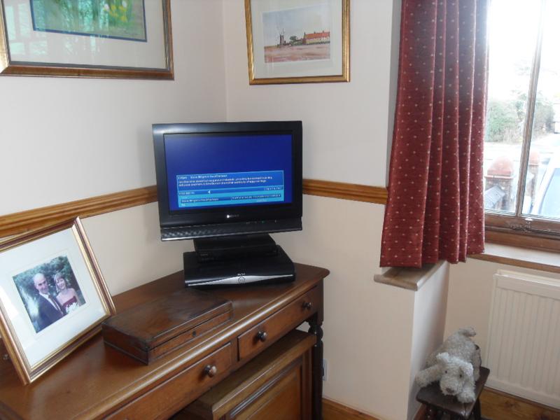 The sitting room before repainting below the dado rail